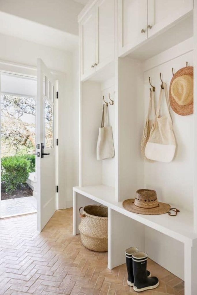 Minimalist white mudroom storage design