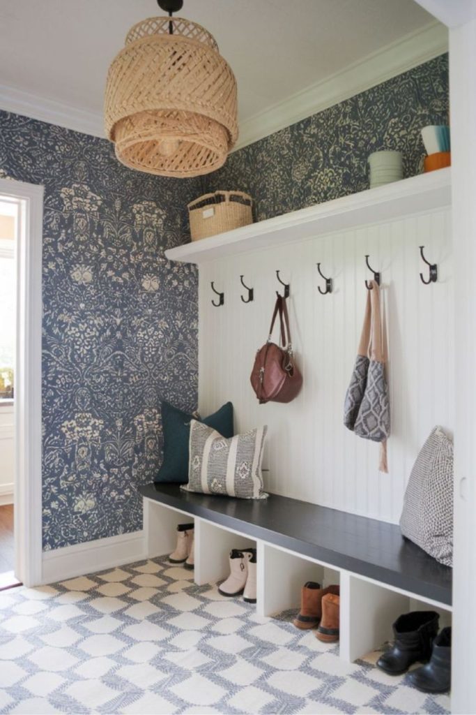 Wallpapered mudroom with organized storage