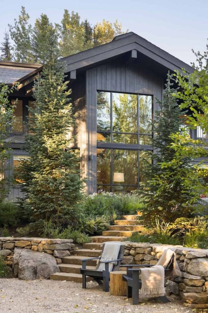 Nature blended hillside house exterior.
