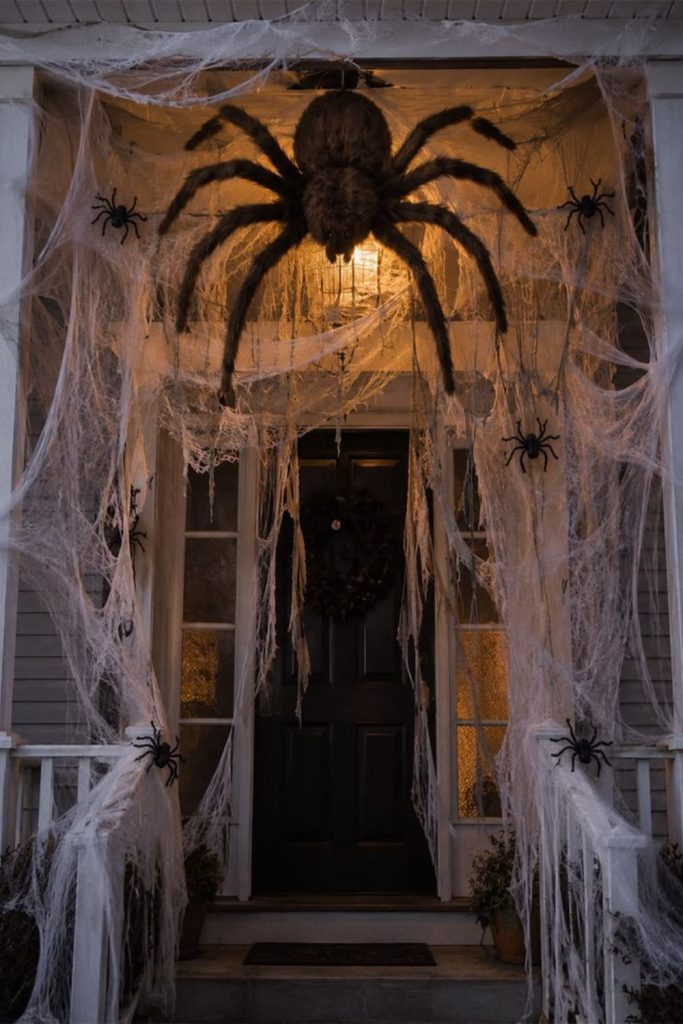 Giant spider webs covering front porch.