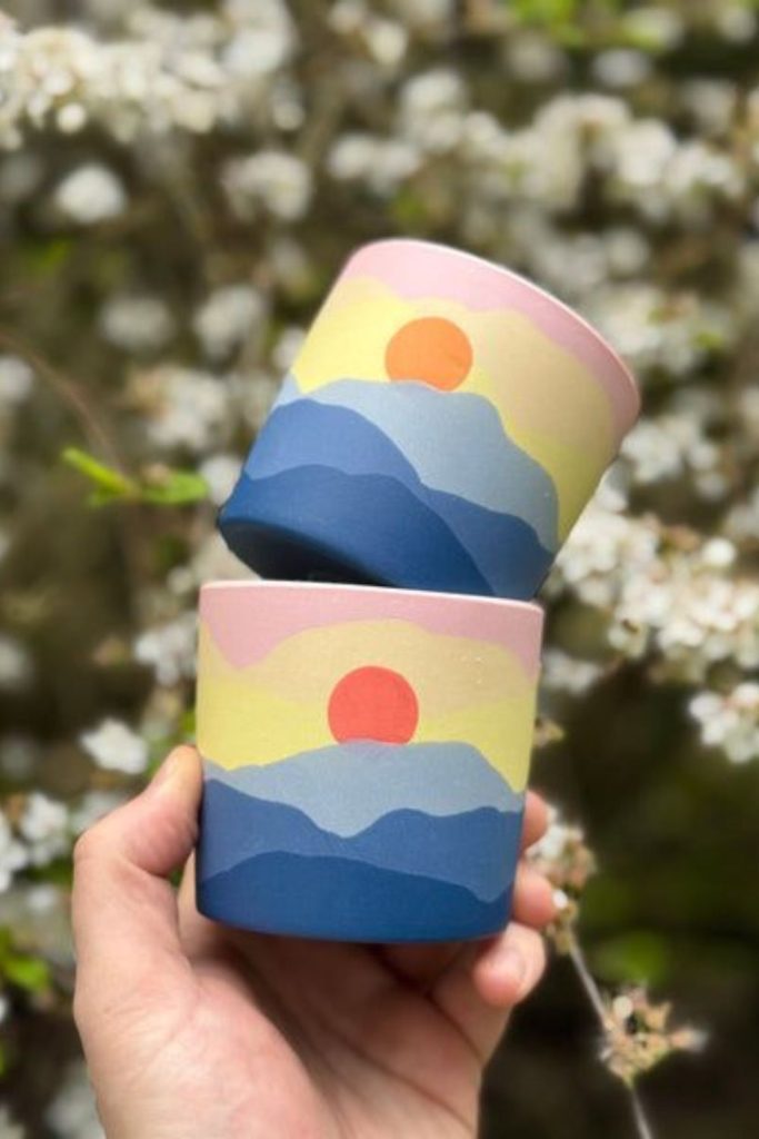 Sunset mountain pottery painting scene.