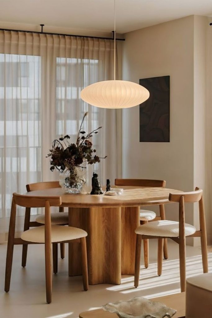 Stone dining table with neutral decor.