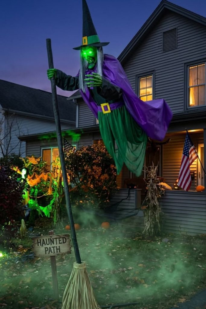 Witch flying above spooky Halloween garden.
