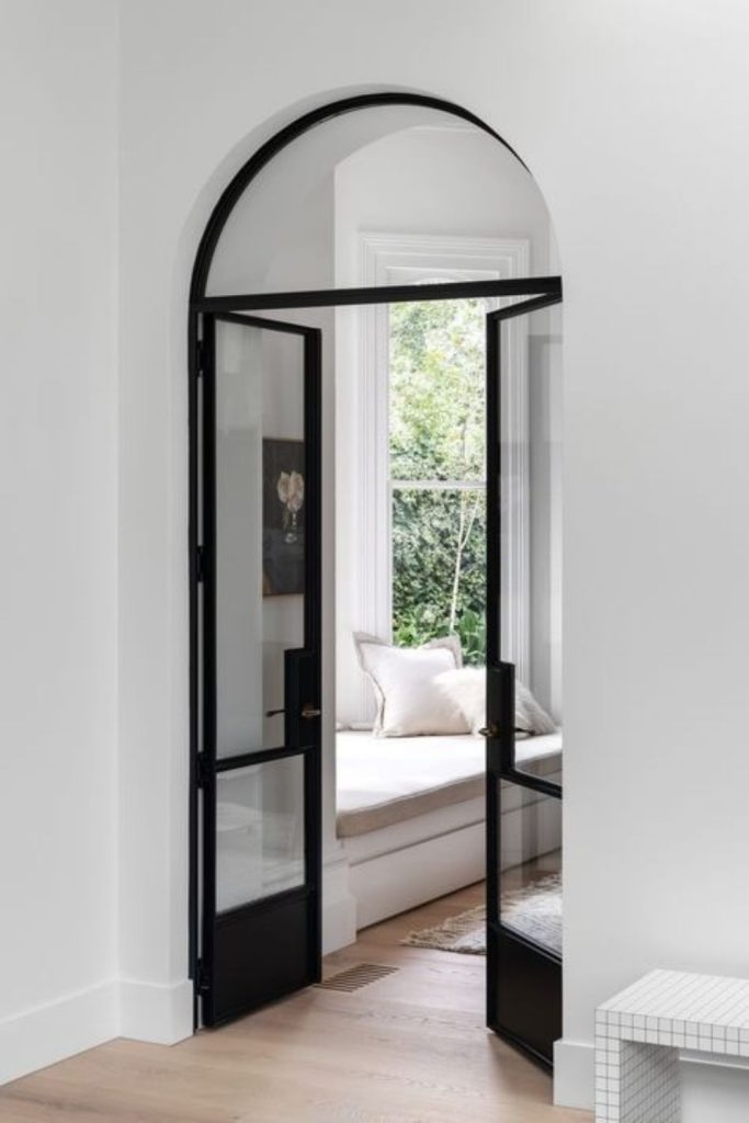 Arched black Crittall statement doorway