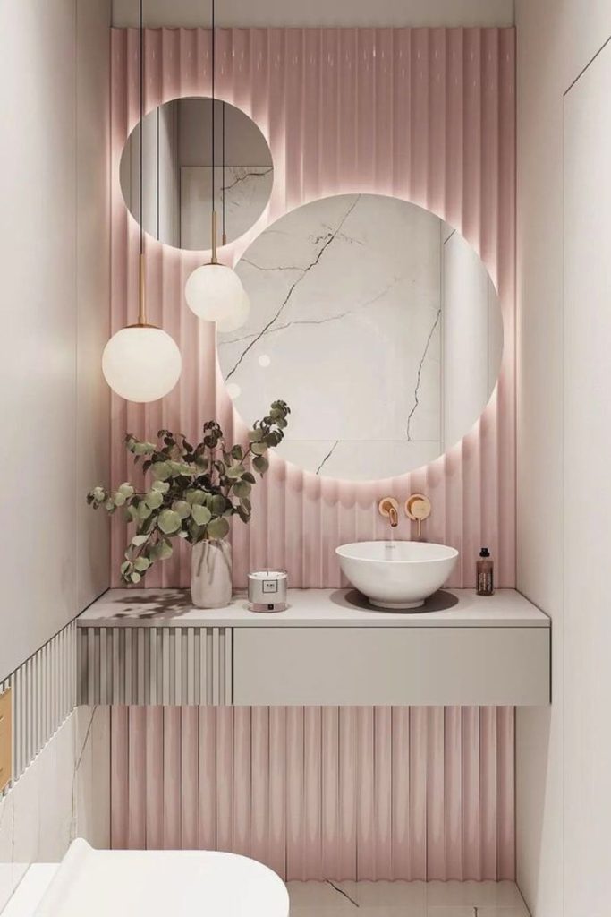 Soft blush boutique powder room.