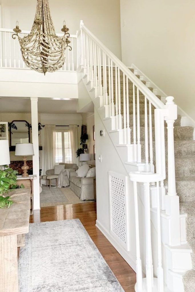 Bright white staircase with wooden treads.