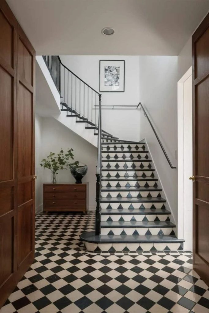 Checkerboard staircase with charcoal white pattern.