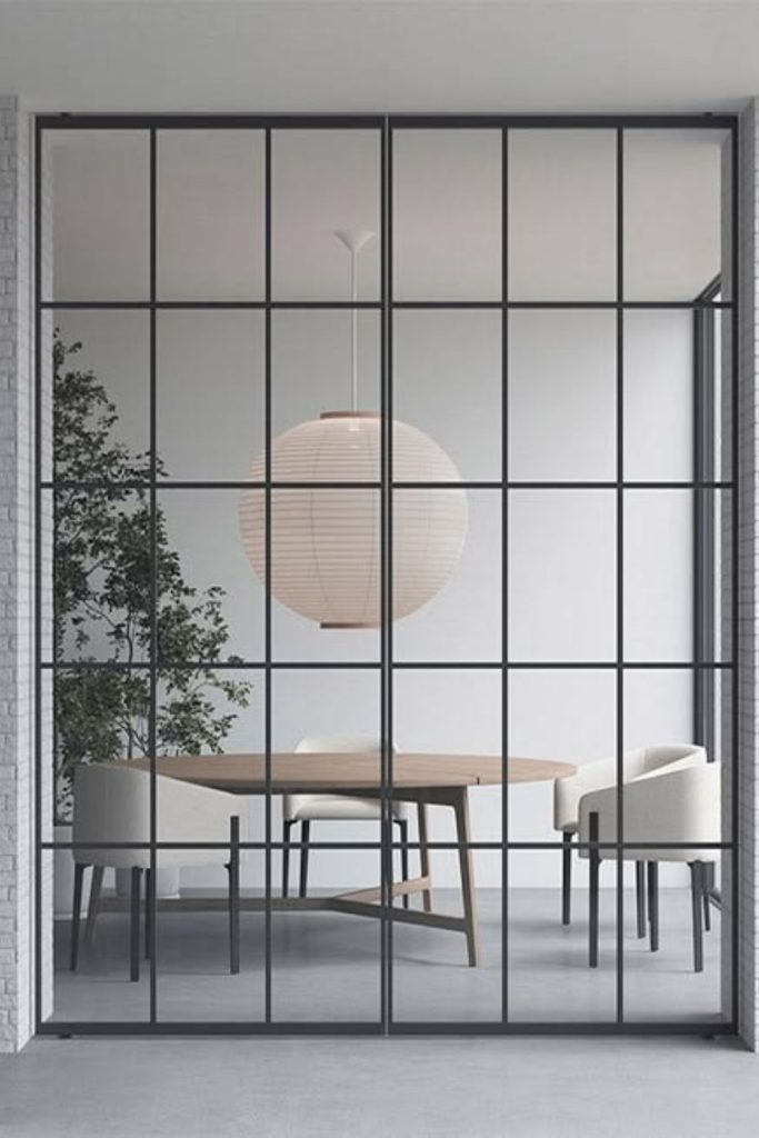 Modern Crittall pivot glass door