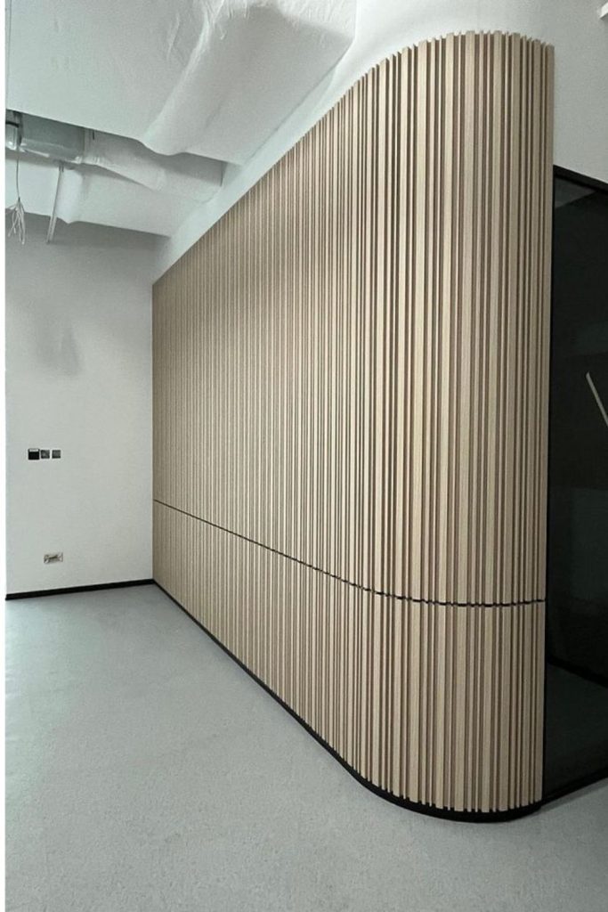 Curved ribbed modern wall paneling.