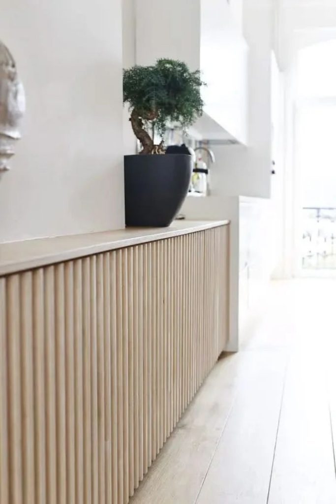 Elegant fluted panel radiator cover idea.