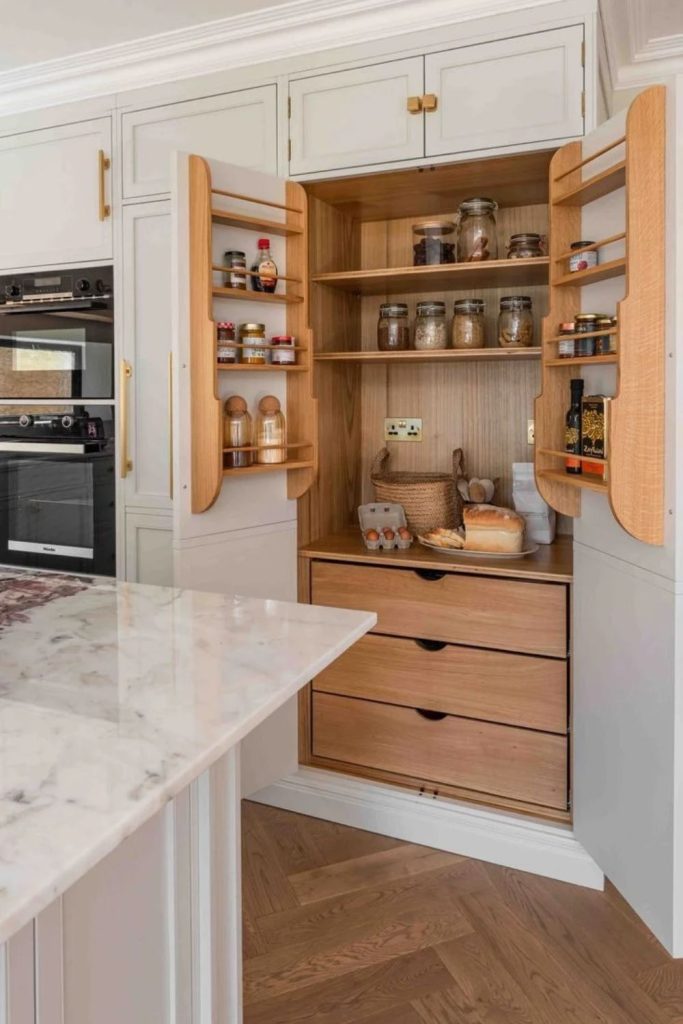 Heritage-style larder with timber shelving.