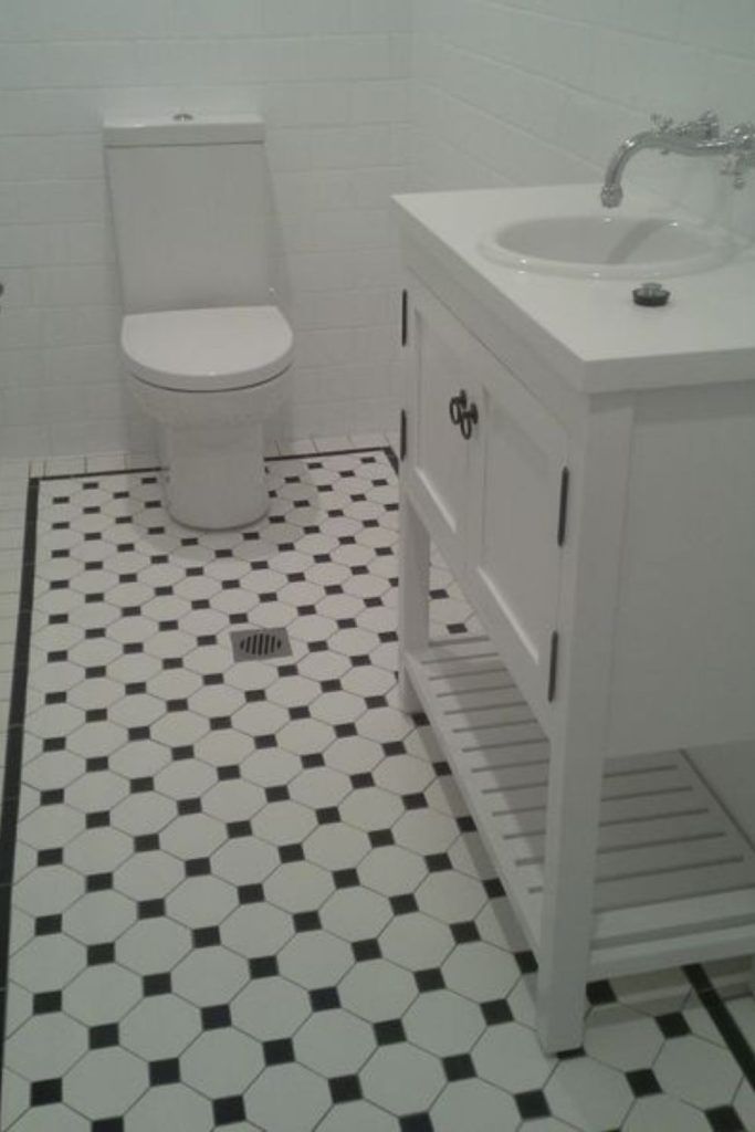 Mini mosaic checkerboard bathroom floor.