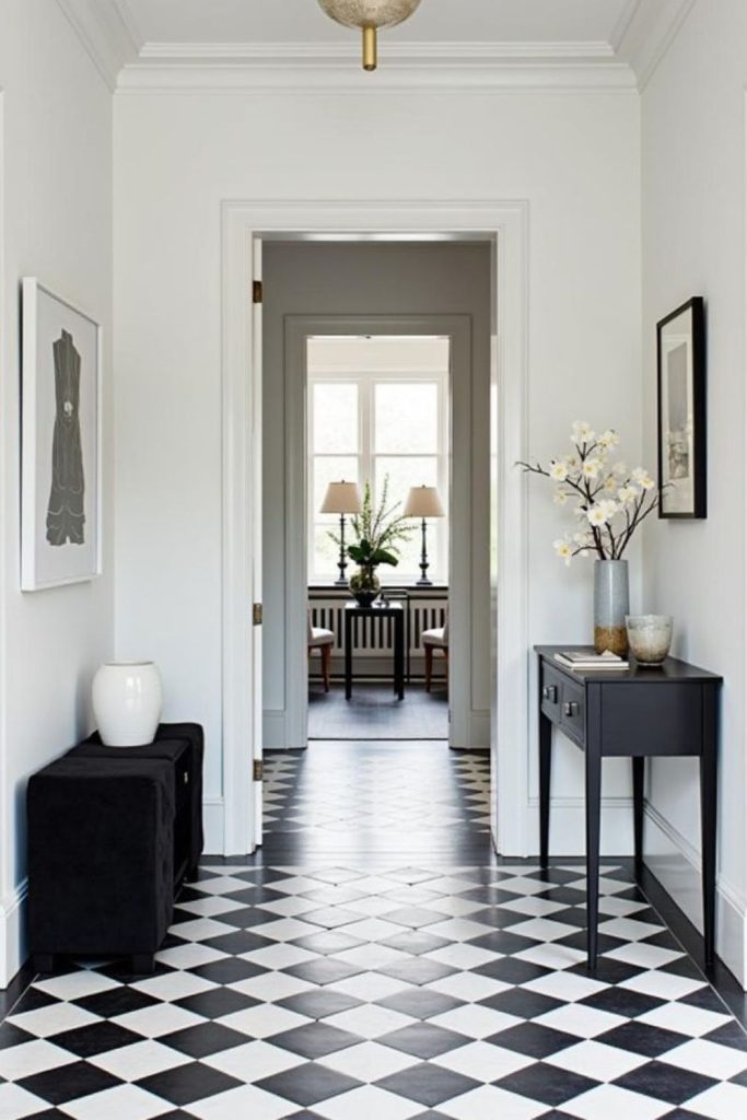 Monochrome checkerboard hallway flooring design.