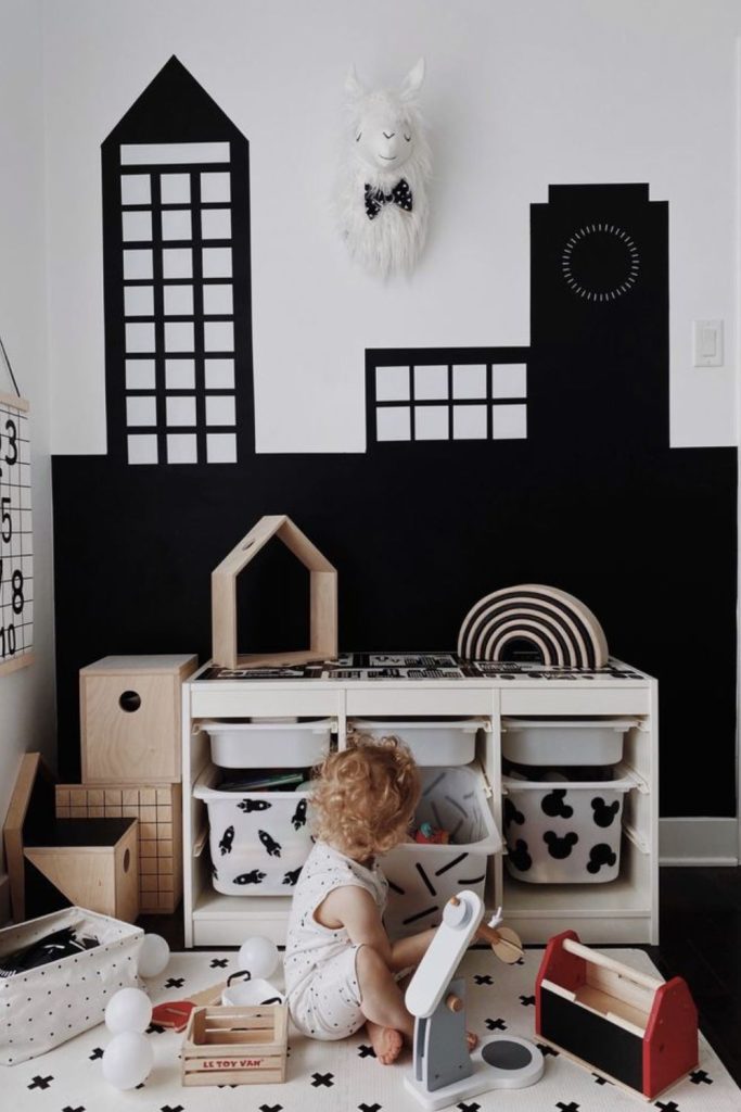 Modern monochrome children's playroom interior.