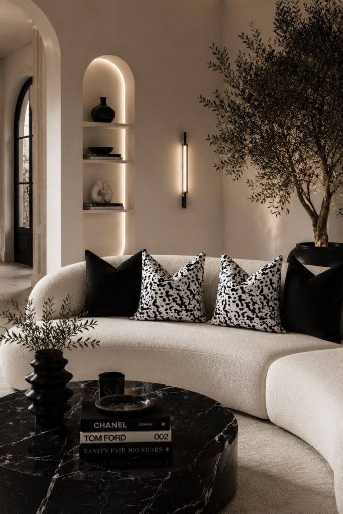 Monochrome curved sofa living room.