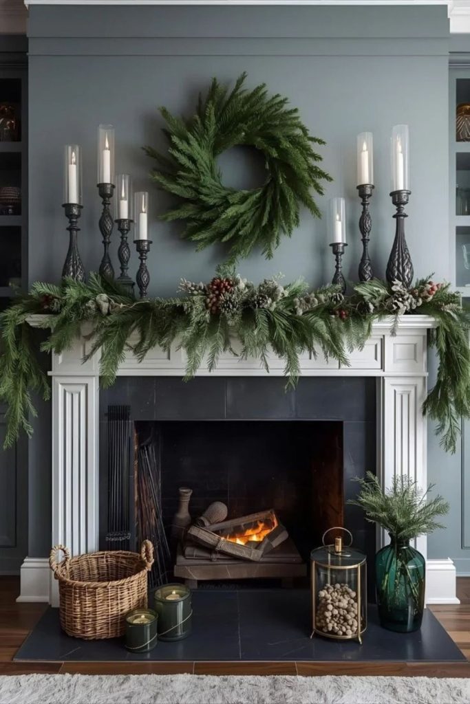 Moody evergreen Christmas mantel with burgundy.