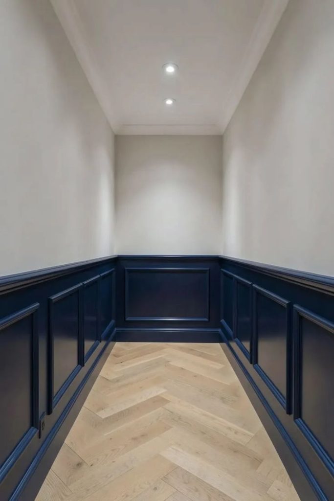 Navy library dado rail walls.