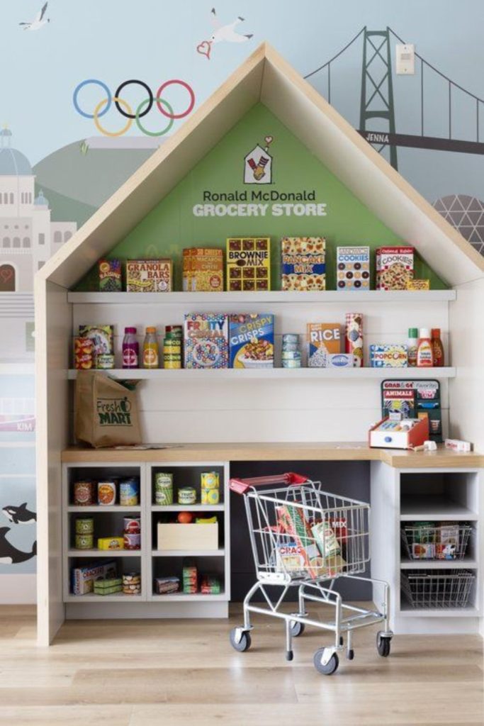 Pretend grocery market playroom setup.