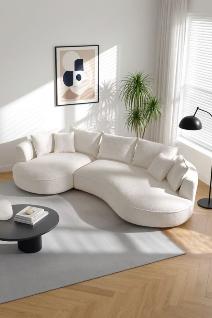 Sculptural curved sofa in ivory.
