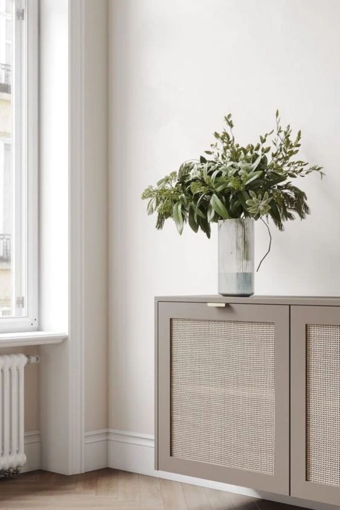 Beige cane cabinet radiator cover.