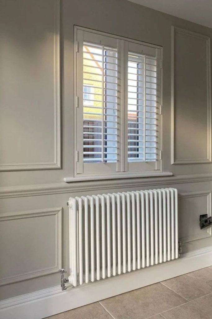 Soft greige paneled radiator cover.