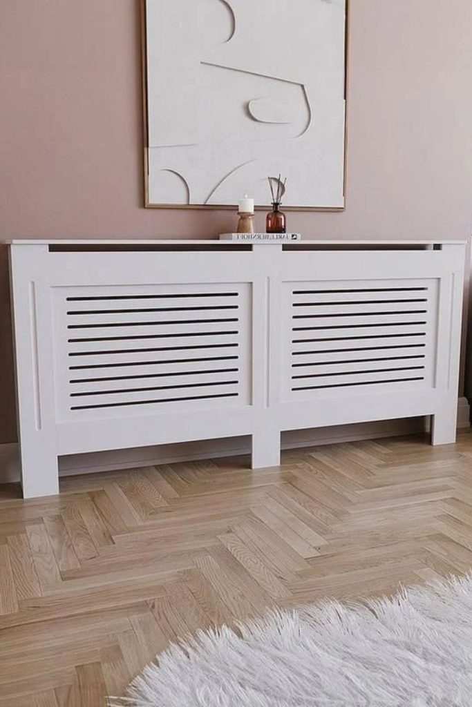 Whitewashed coastal radiator cover design.