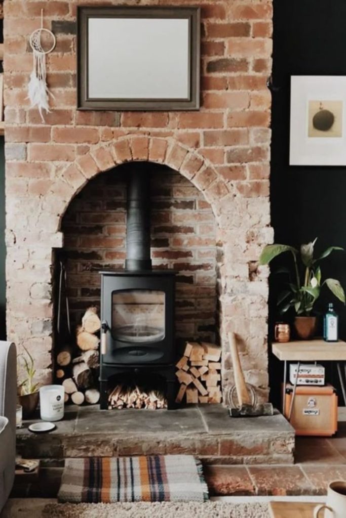 Arched alcove with charming wood burner.