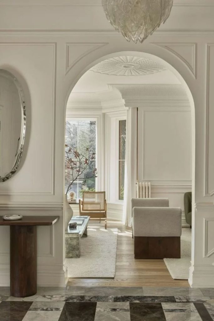 Arched entry with classic wall molding.
