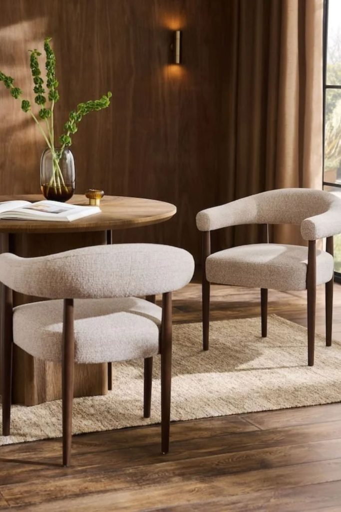 Bouclé Dining Armchairs Around Wooden Table