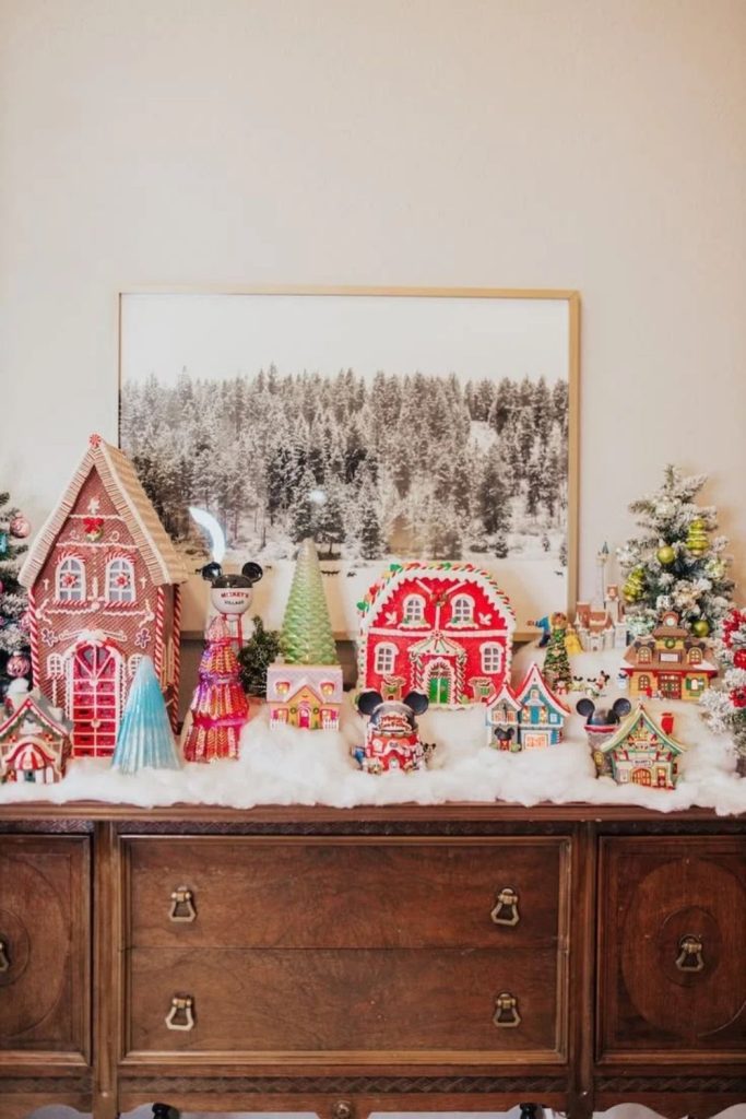 Candy cane Christmas village with colorful cottages.