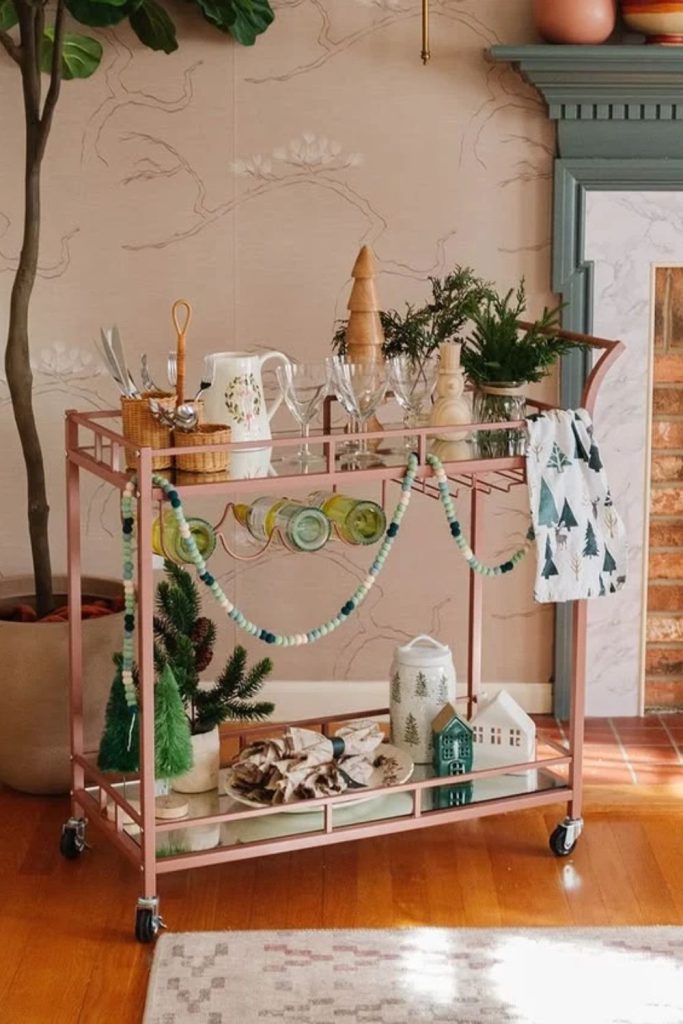 Christmas cookie cocktail bar cart with sweet treats.