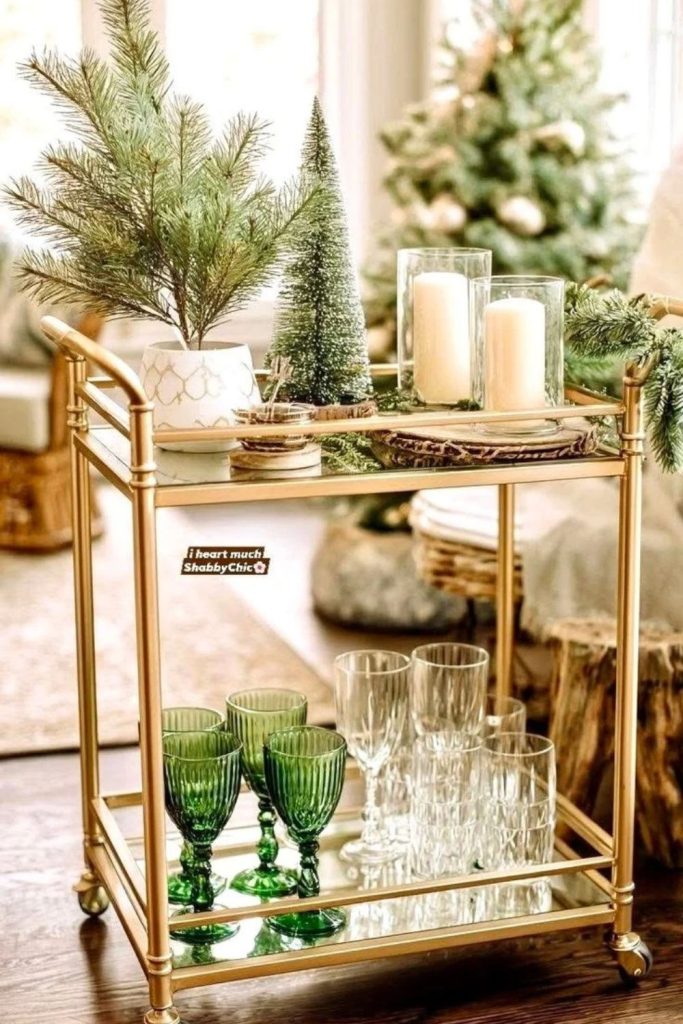 Miniature Christmas tree bar cart with festive lights.
