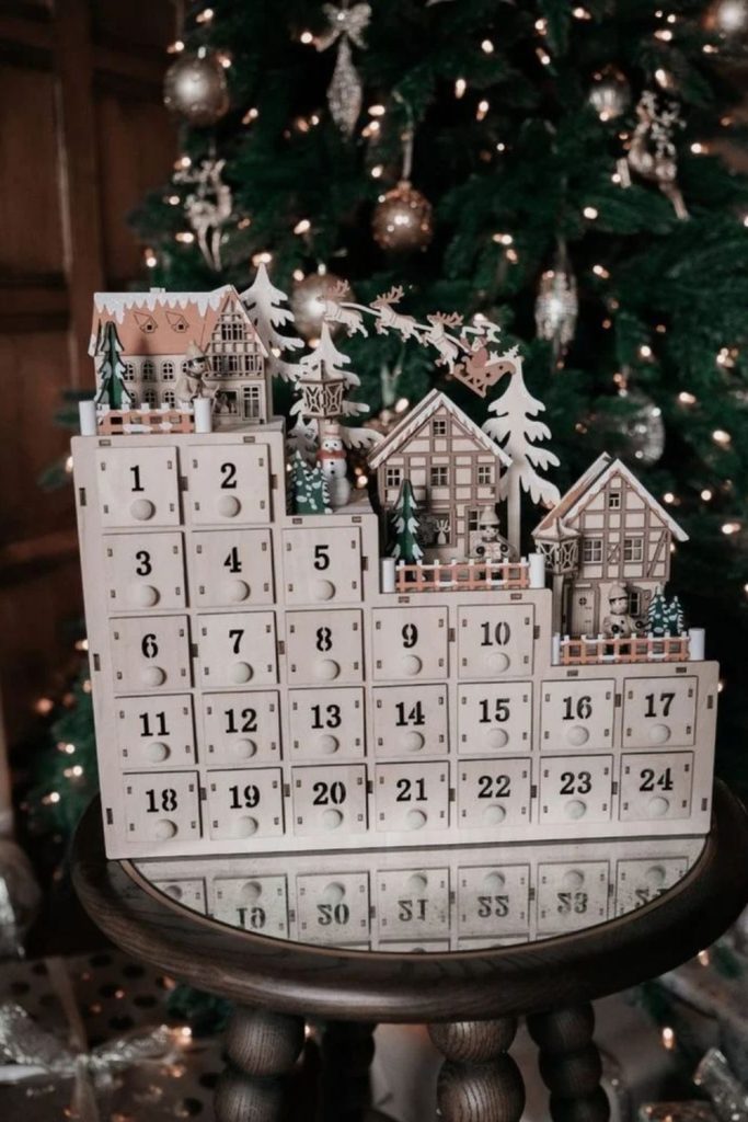 Miniature Christmas village advent calendar display.