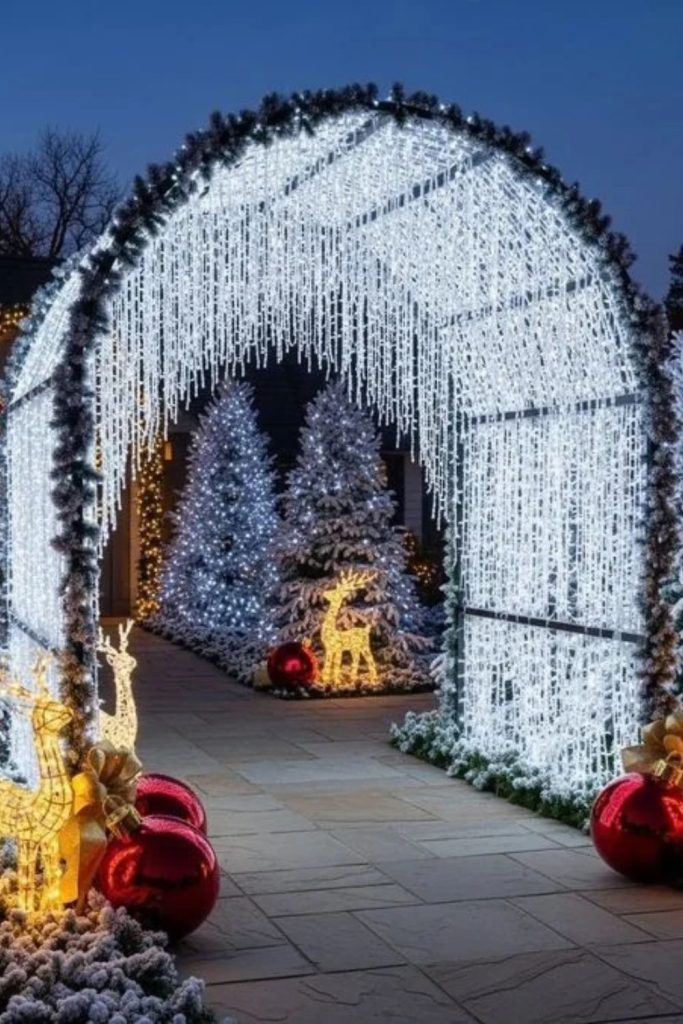 Magical illuminated Christmas archway with evergreen garlands.