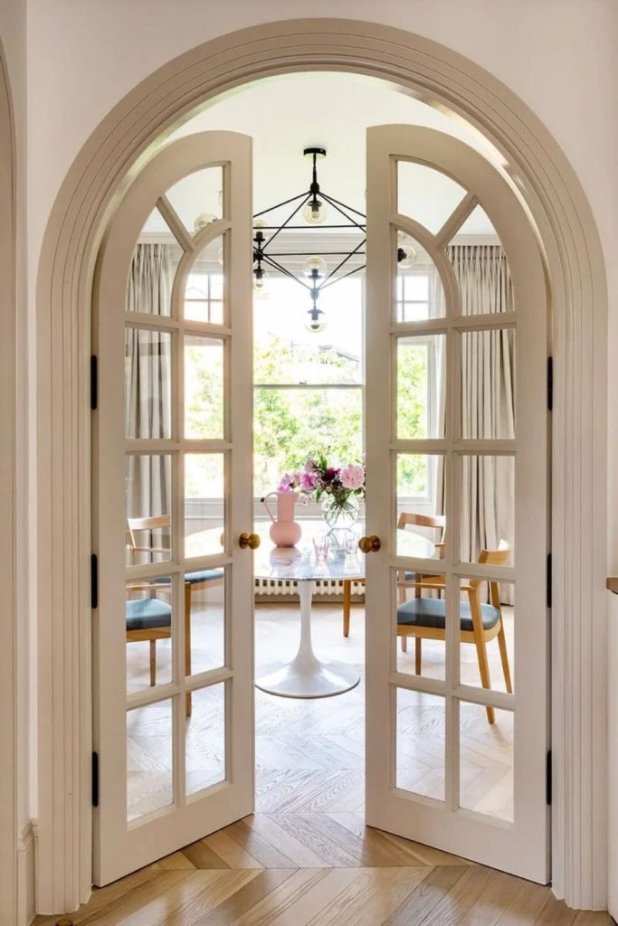 French-inspired arched door with timeless elegance.