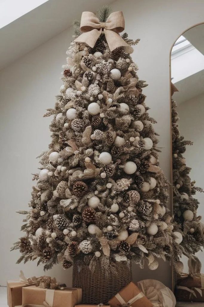 Frosted pine Christmas tree with silver baubles.