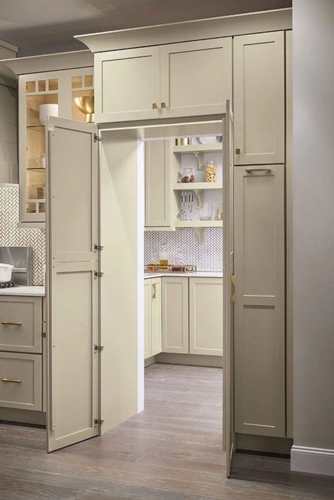 Hidden pantry behind seamless cabinet doors.