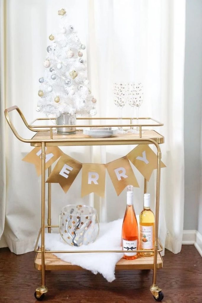 Metallic Christmas bar cart with shimmering holiday accents.