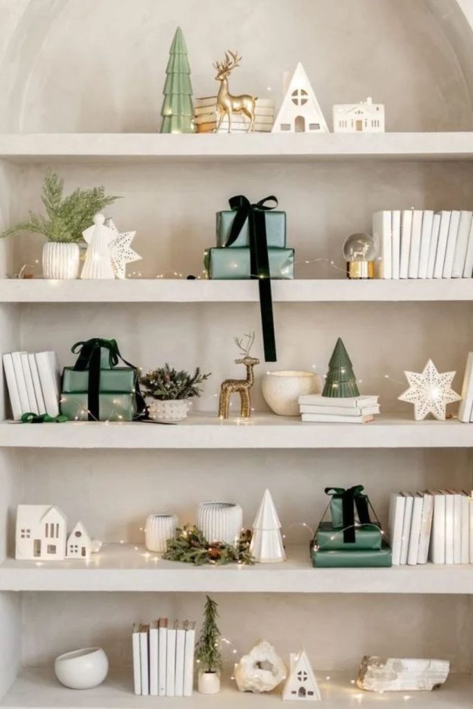 Minimalist Christmas shelf with white ceramic trees.