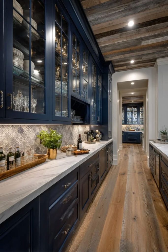 Moody navy pantry with golden hardware.