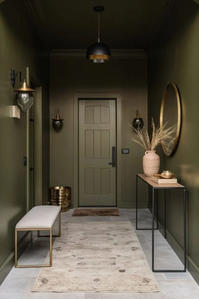 Moss green earthy colour drenched entryway.