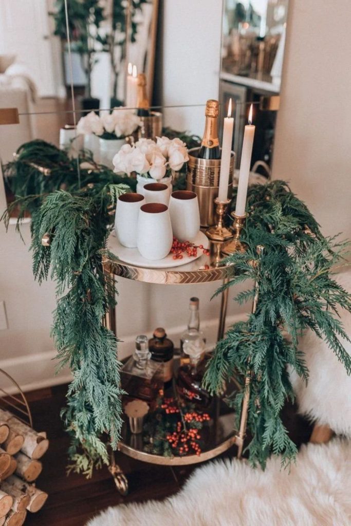 Eucalyptus Christmas bar cart with natural greenery.