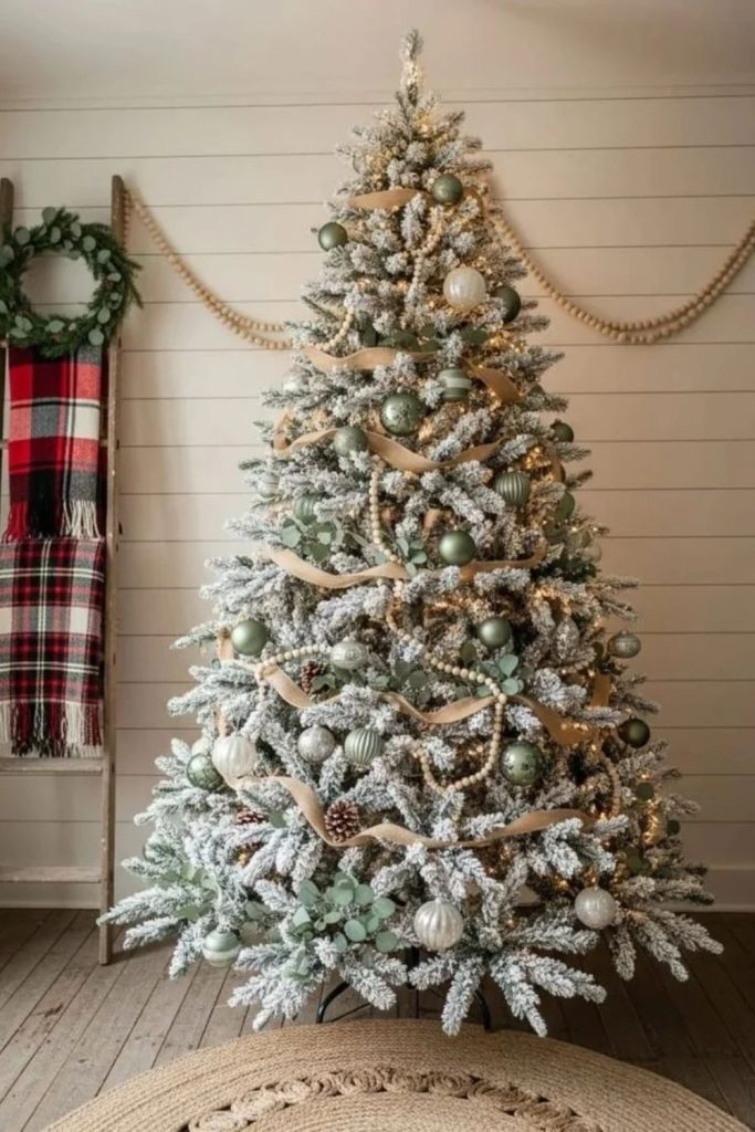 Natural eucalyptus flocked Christmas tree with greenery.