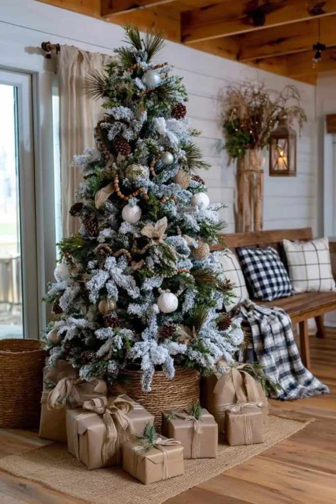 Rustic farmhouse flocked Christmas tree with wooden ornaments.