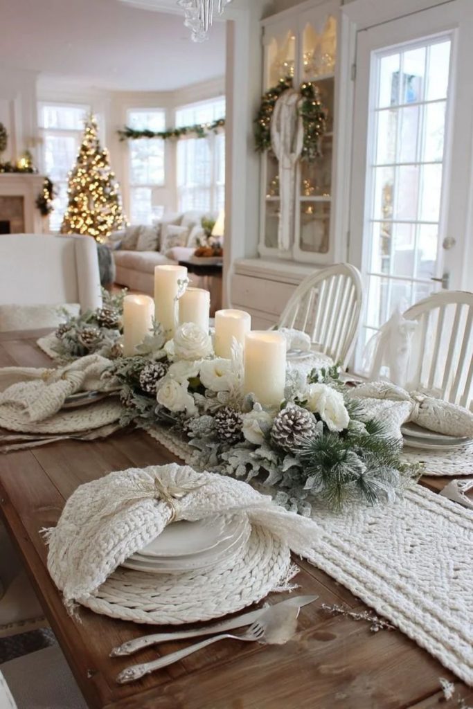 Rustic white Christmas table with natural wooden details.