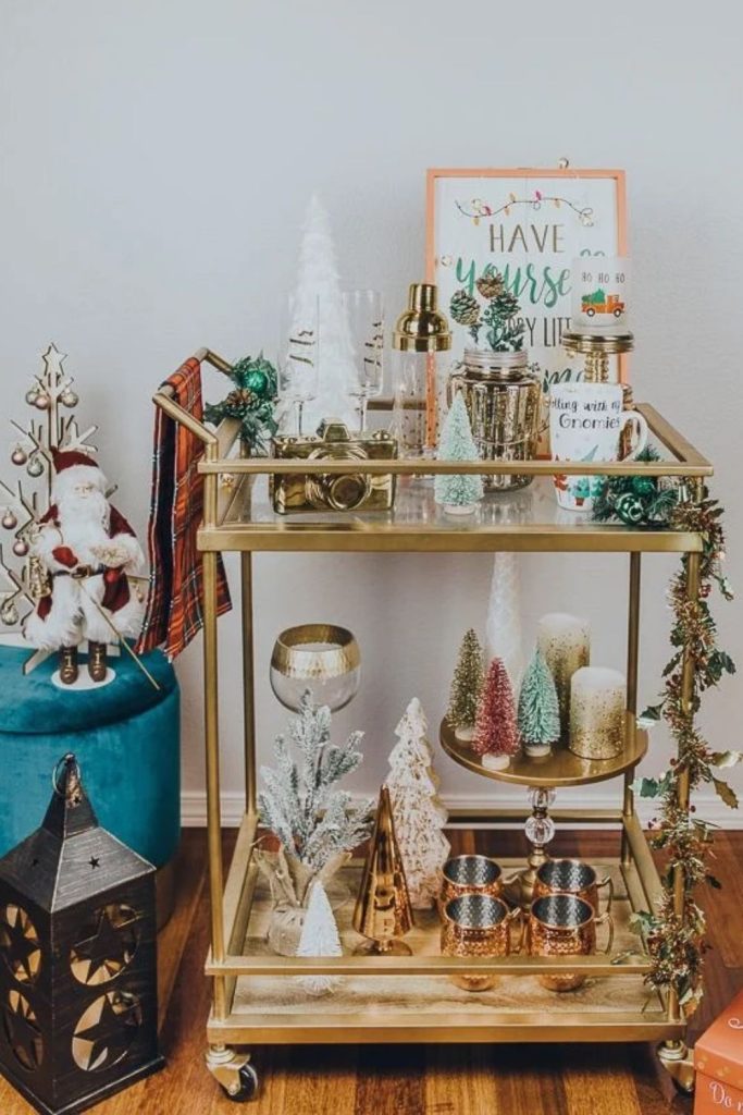 Santa-themed Christmas bar cart with playful decorations.