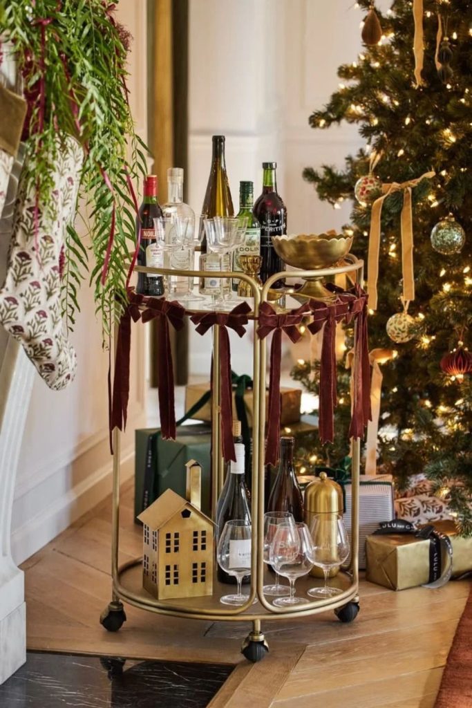 Vintage Christmas bar cart with nostalgic decorations.