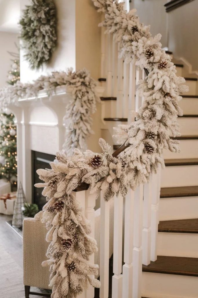White staircase garland with festive ribbon accents.