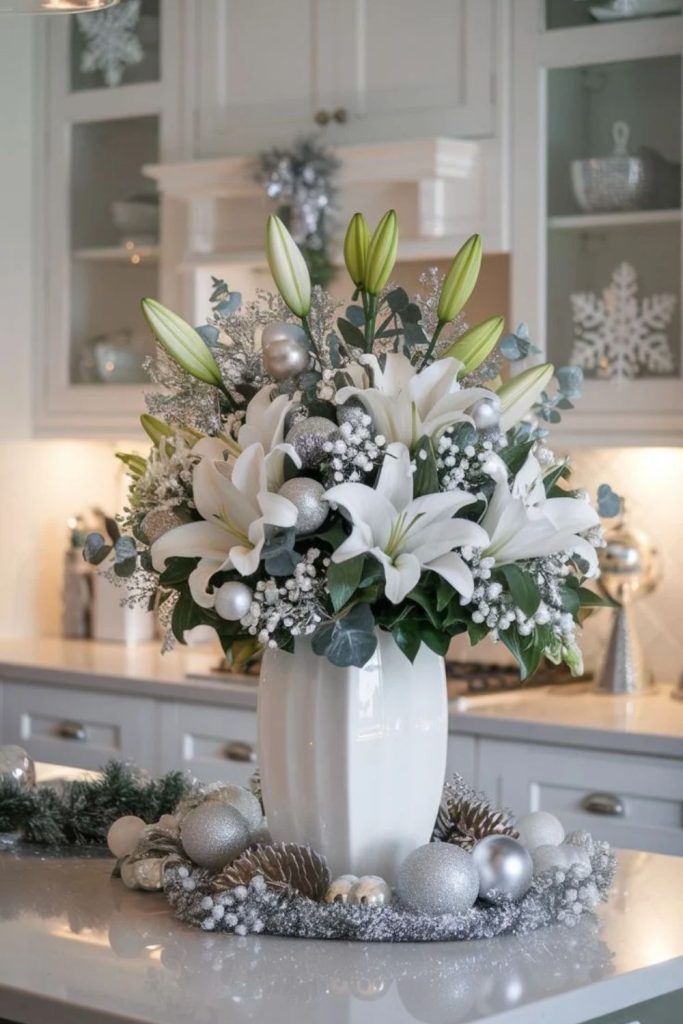White poinsettia Christmas arrangement with evergreen branches.